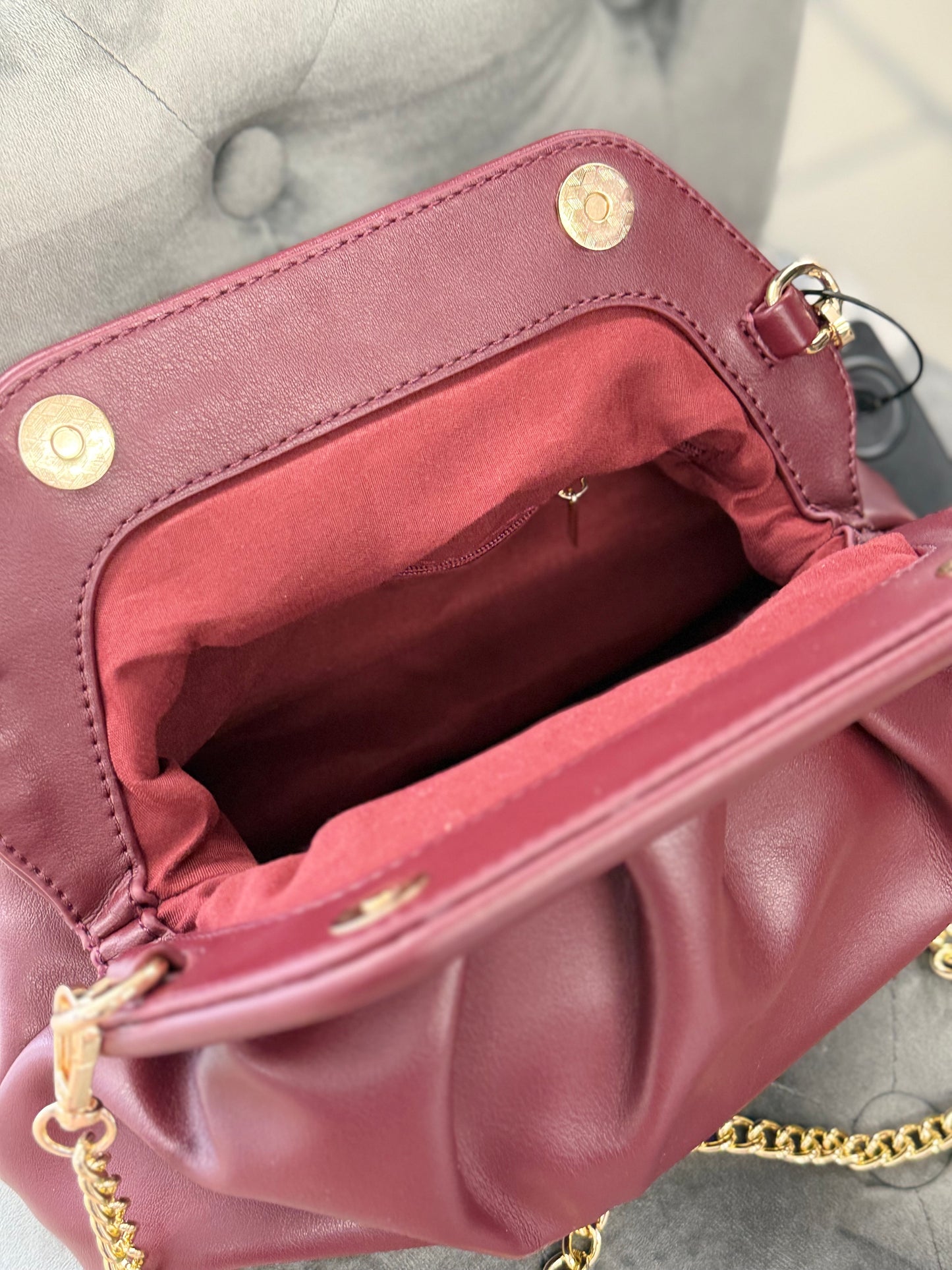 Borsa clutch con tracolla a catena