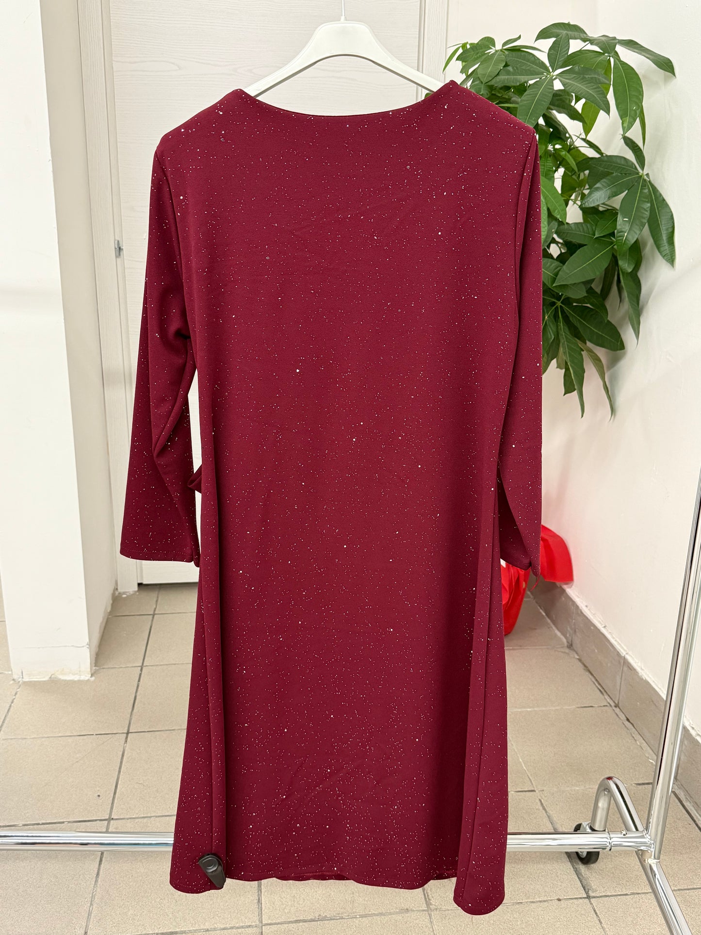 Abito lungo brillantinato con fiocco laterale