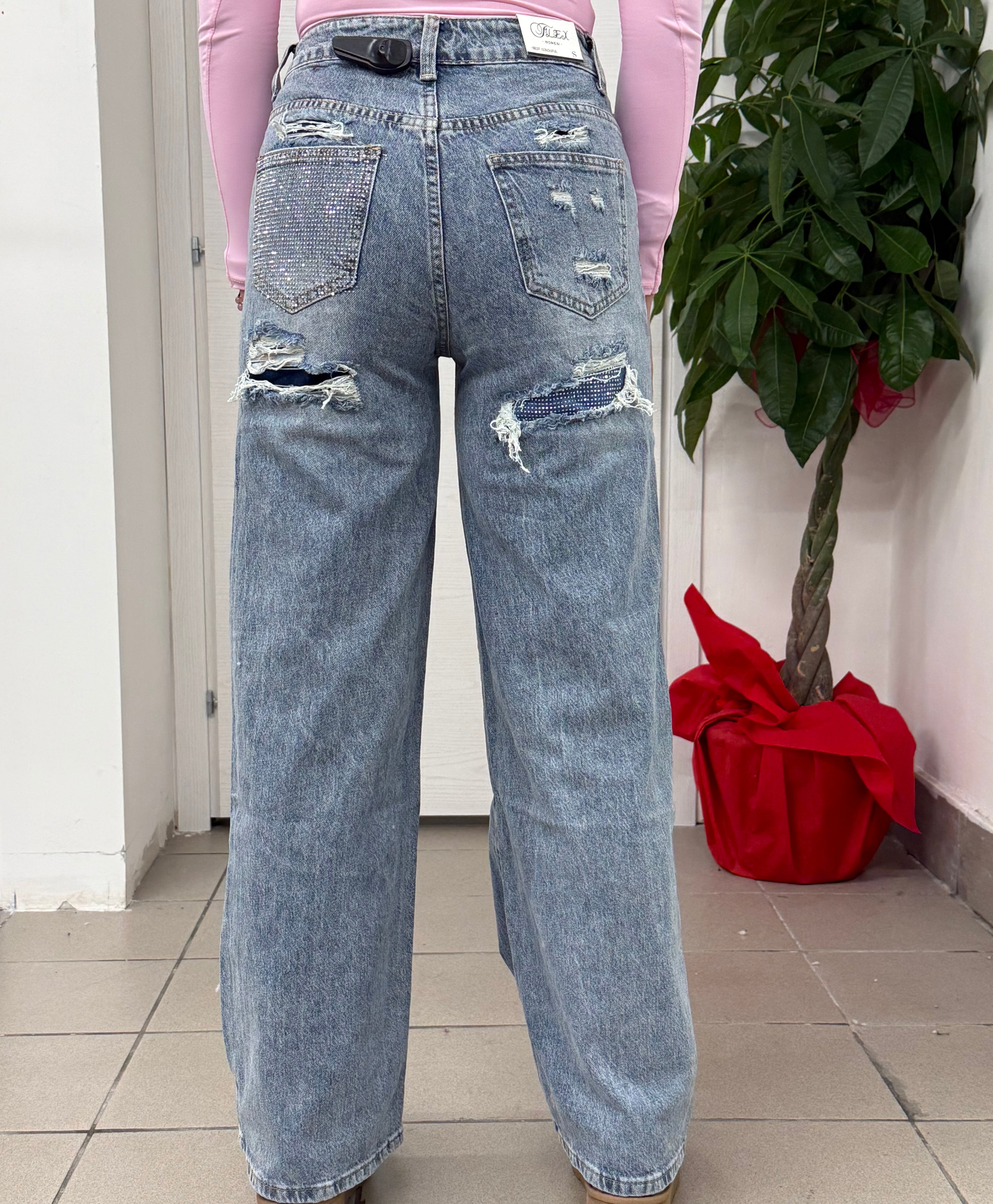 Jeans a palazzo con taschino e strappo brillantinato