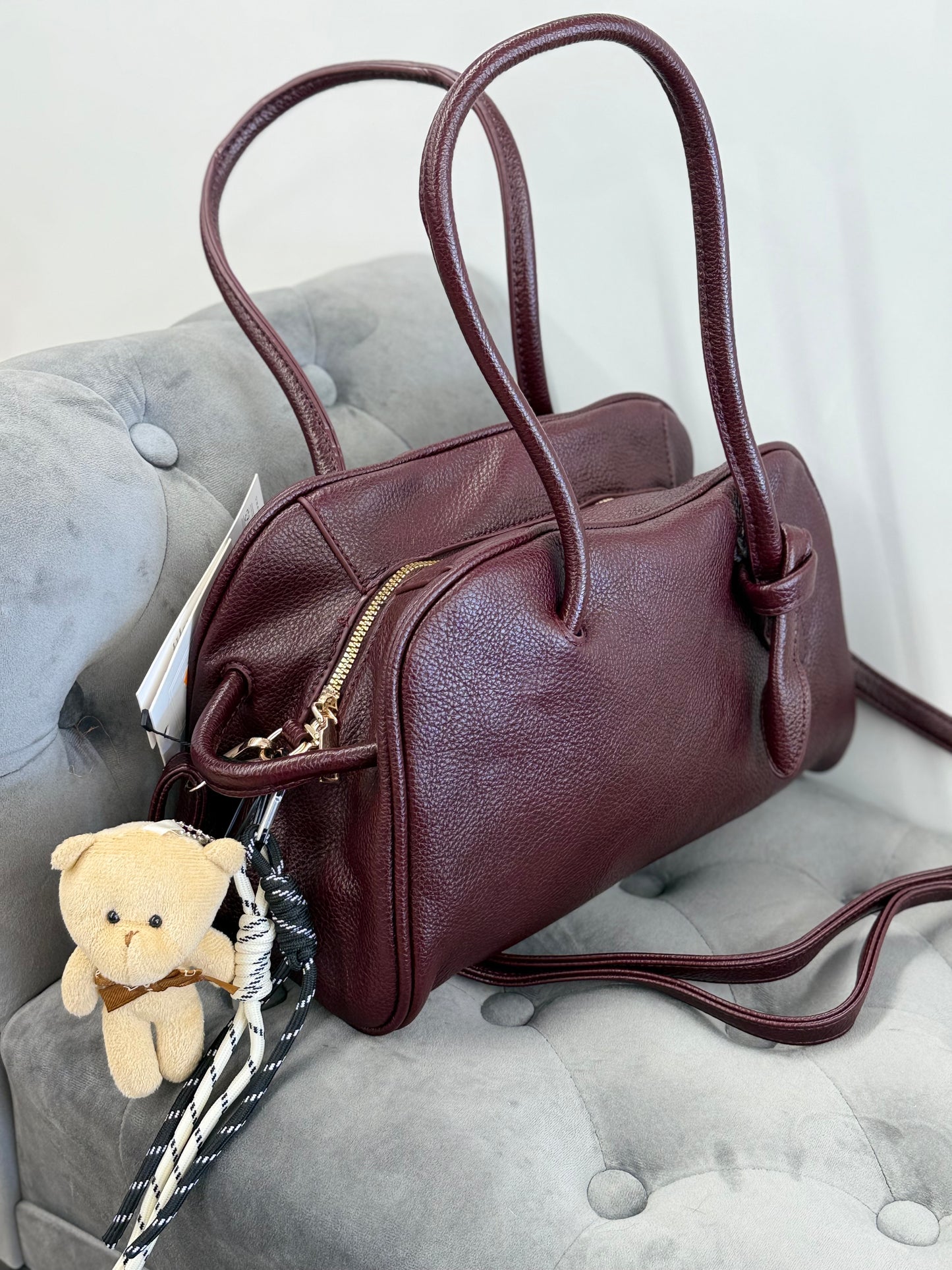 Borsa baguette con accessori e tracolla