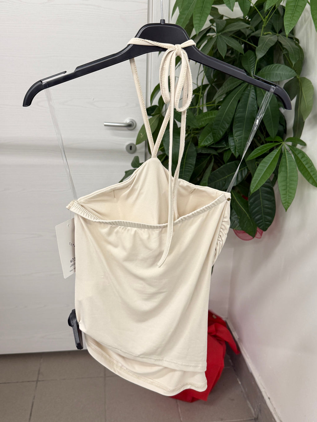 Top in lycra con taglio obliquo e borchie FGD MODA
